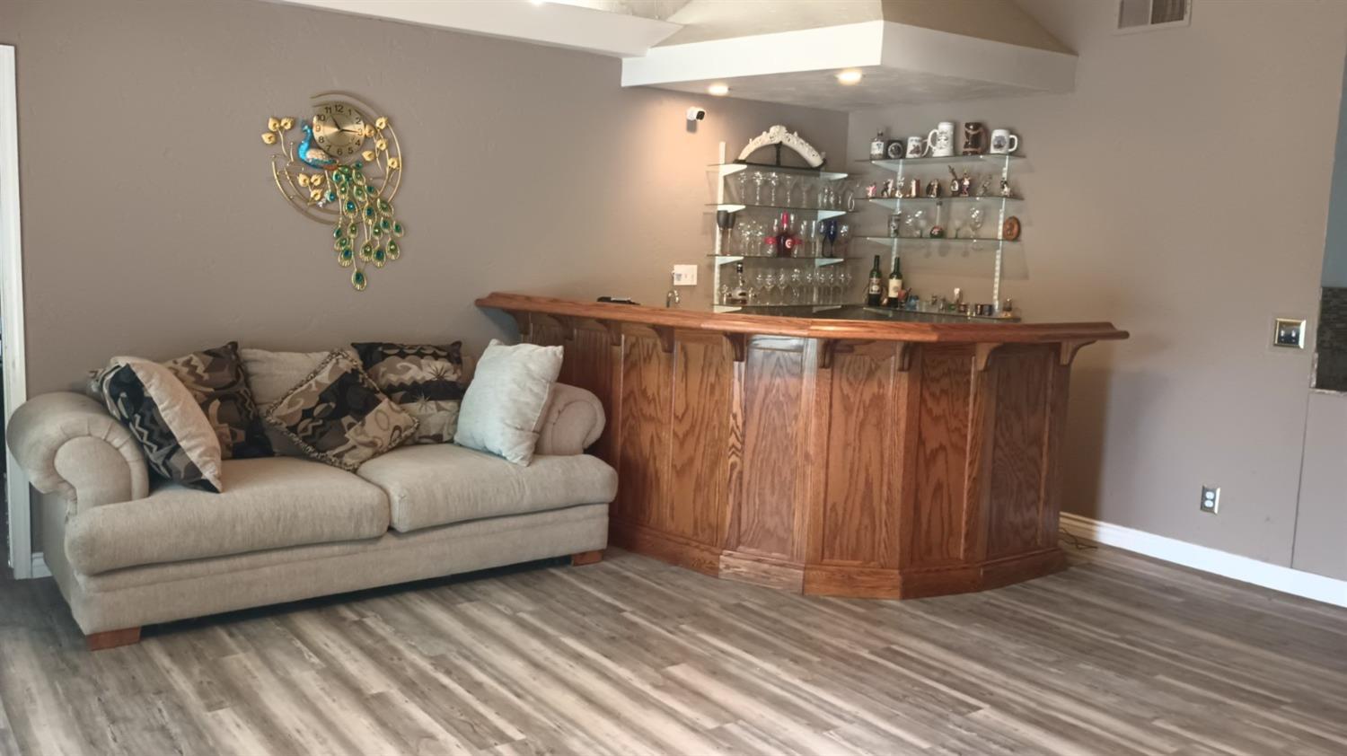 14728 Huntington Road Madera, CA 93636 - Photo 25 of 37 a living room with furniture and wooden floor