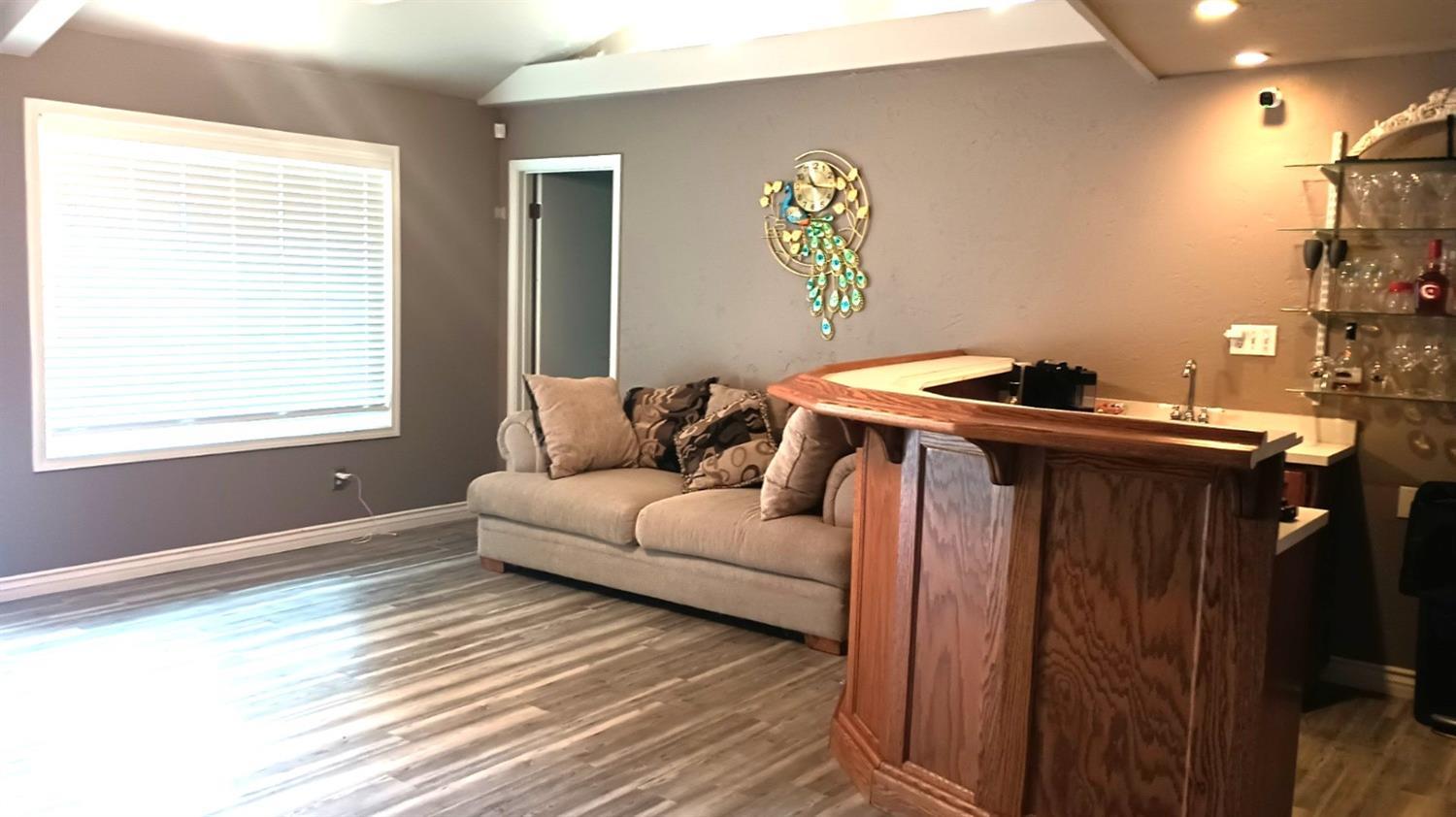 14728 Huntington Road Madera, CA 93636 - Photo 26 of 37 a living room with furniture and a window