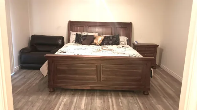 a bedroom with a bed and a window