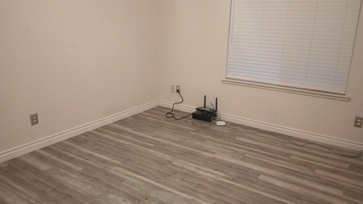 14728 Huntington Road Madera, CA 93636 - Photo 34 of 37 a view of a room with wooden floor and a window