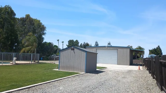 a view of a backyard with a garden and plants