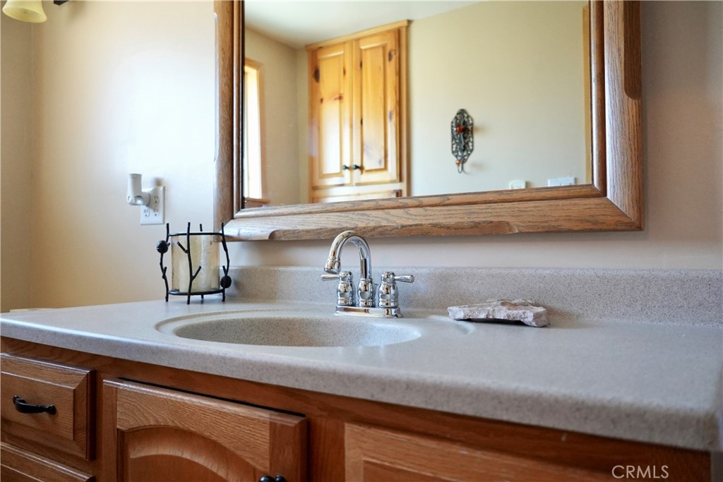 42958 Moonridge Road Big Bear Lake, CA 92315 - Photo 14 of 19 a bathroom with a sink and a mirror