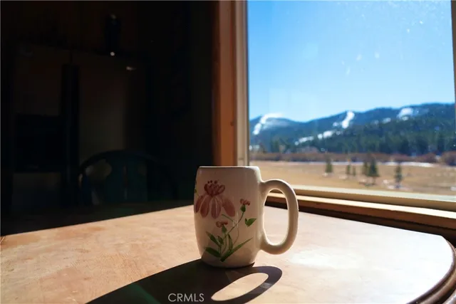 a view of a balcony with yard