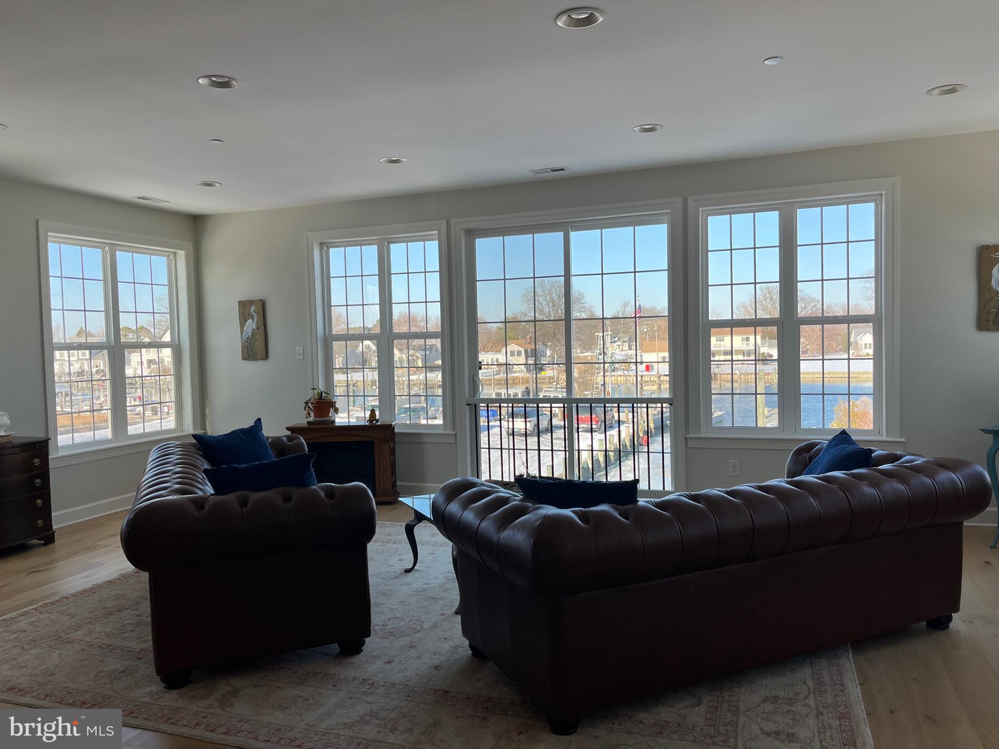 21572 Chicken Point Road Tilghman, MD 21671 - Photo 3 of 13 a living room with furniture and windows