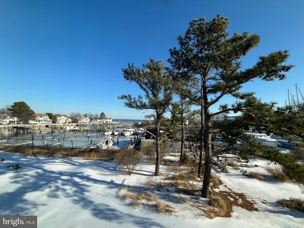 a picture of a room with a white wall and a large window