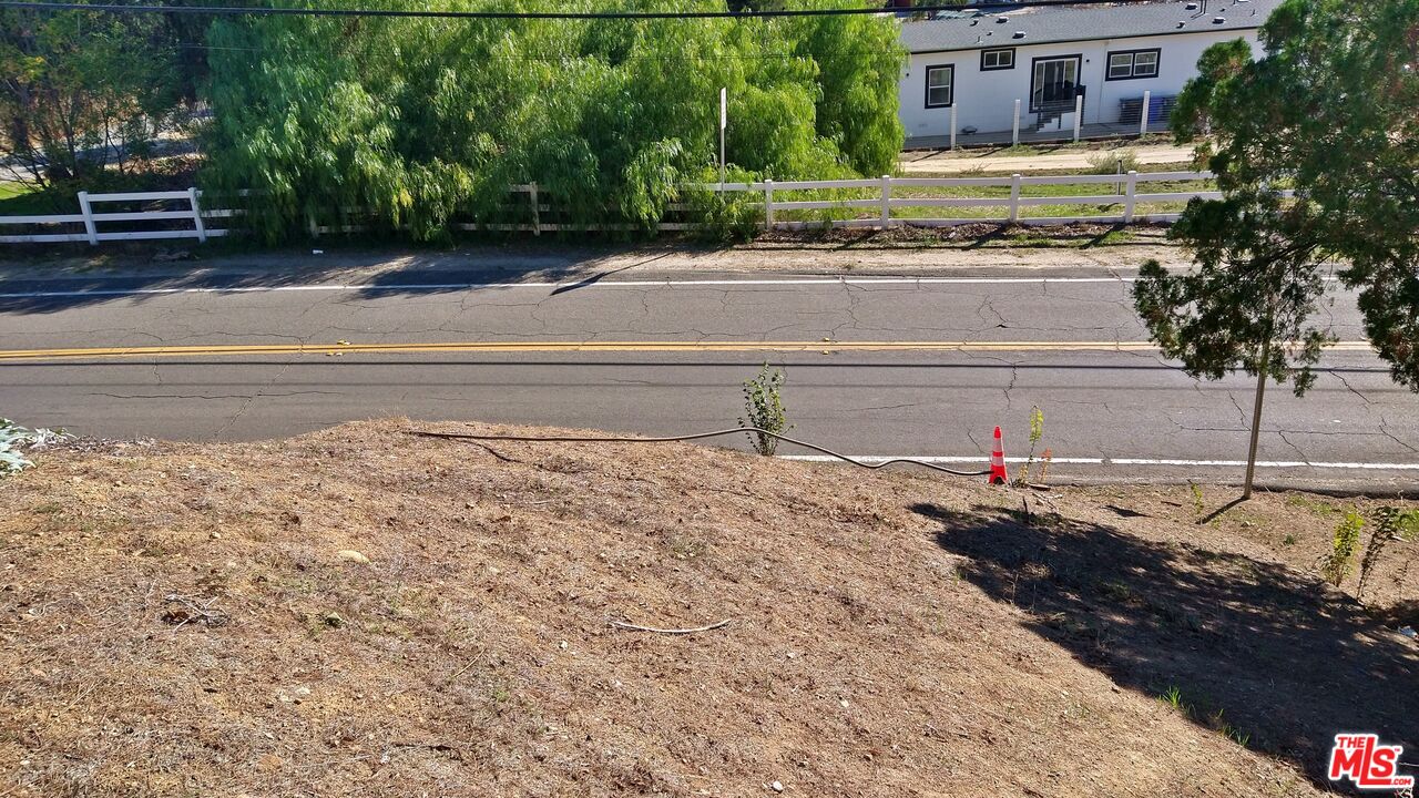 30000 Madison Way Val Verde, CA 91384 - Photo 6 of 11 a view of a backyard of the house