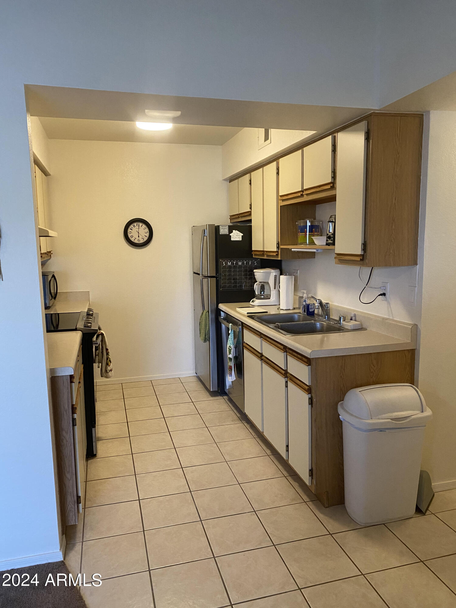 1440 North Idaho Road, Unit 1013 Apache Junction, AZ 85119 - Photo 19 of 40 a kitchen with a sink appliances and cabinets