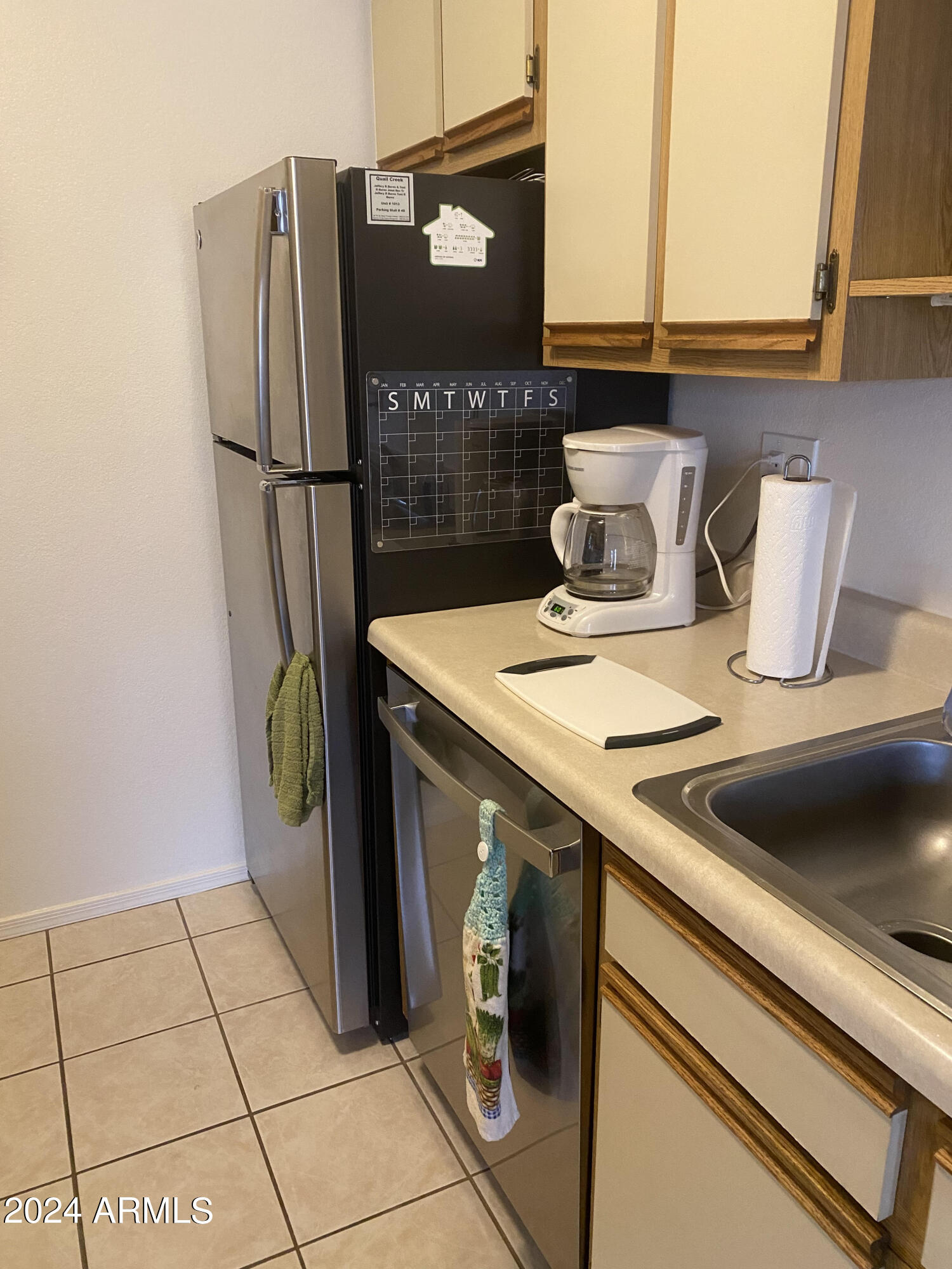 1440 North Idaho Road, Unit 1013 Apache Junction, AZ 85119 - Photo 24 of 40 a kitchen with a refrigerator and a stove