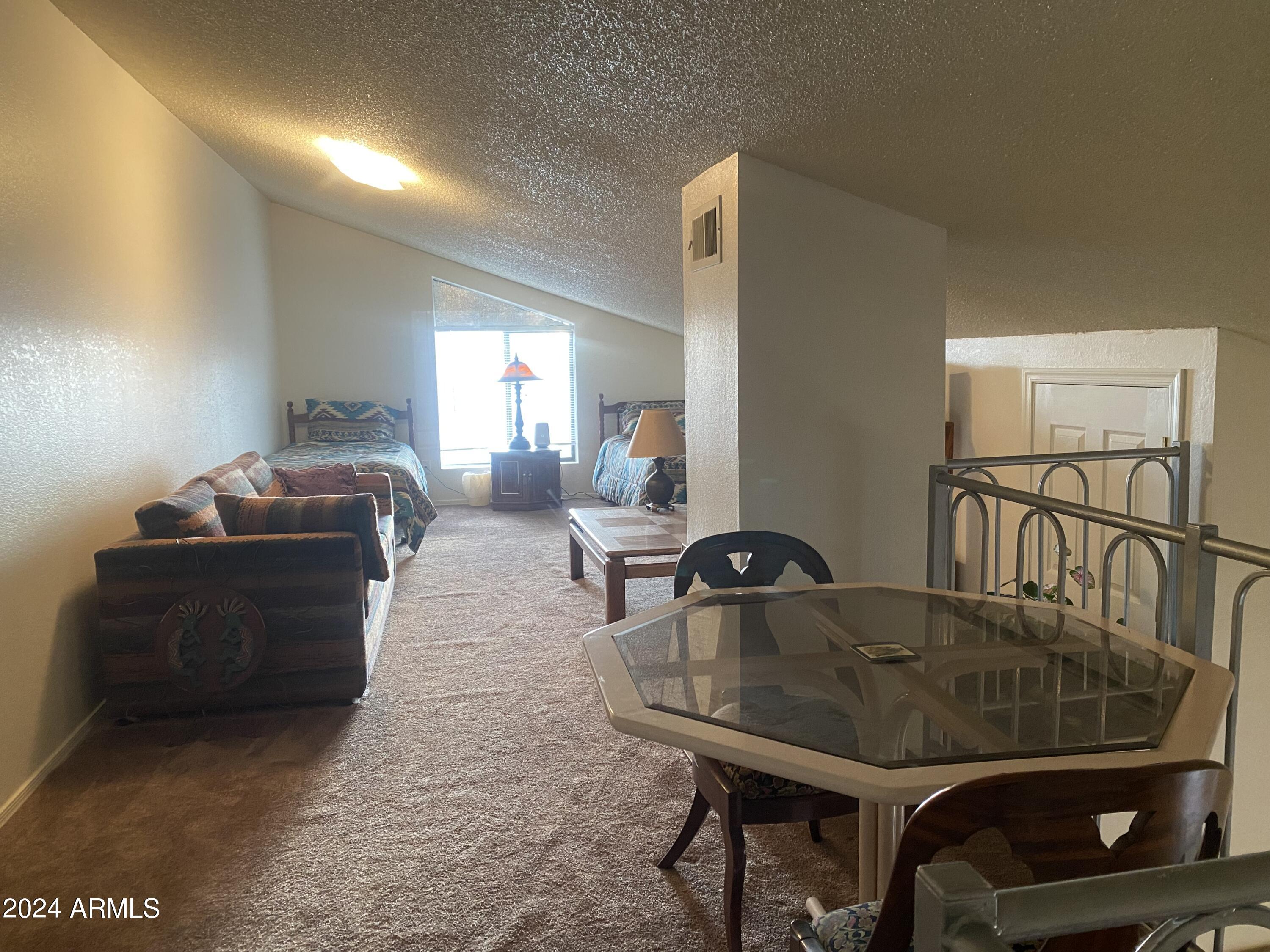 1440 North Idaho Road, Unit 1013 Apache Junction, AZ 85119 - Photo 28 of 40 a living room with furniture