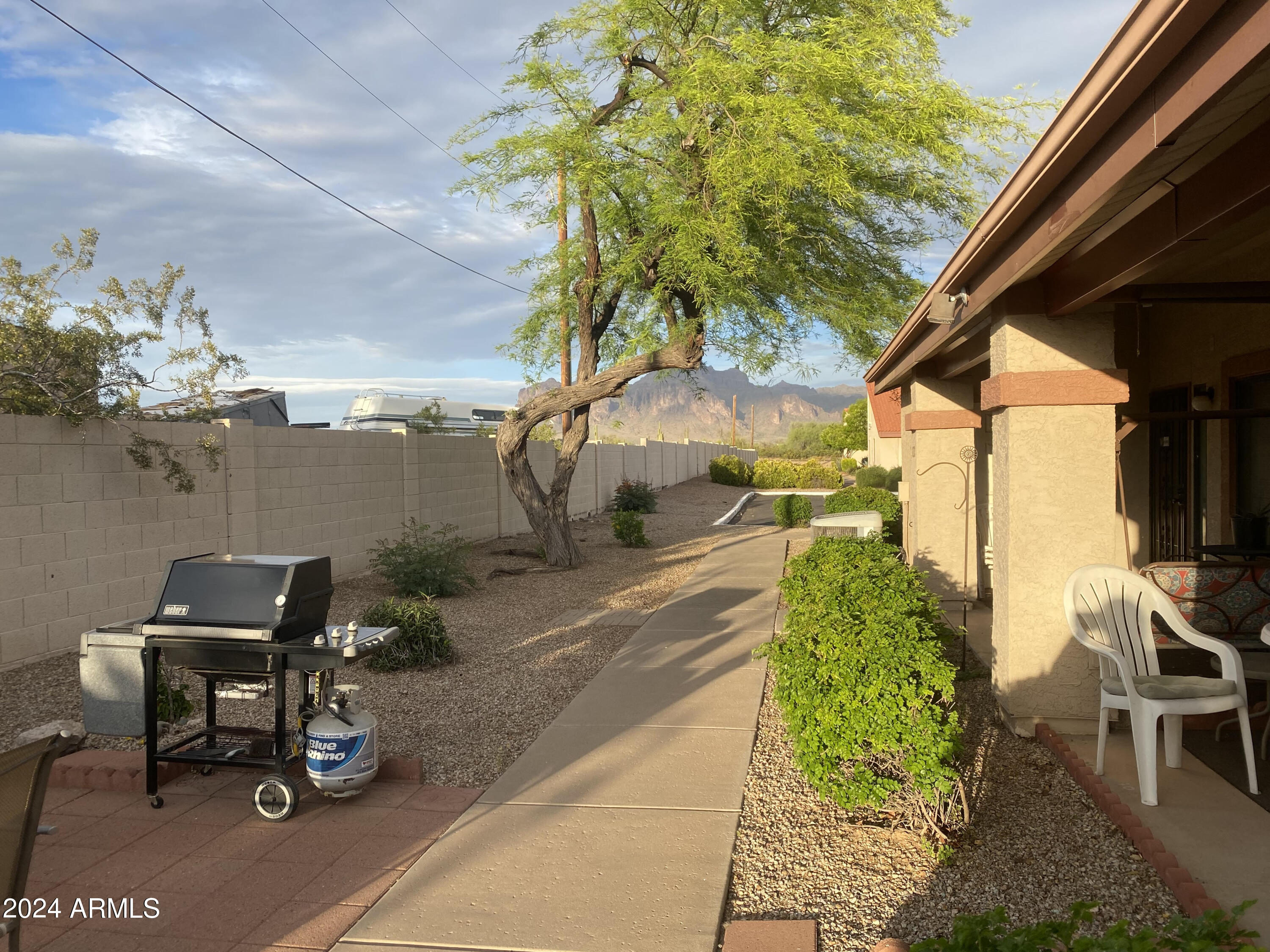 1440 North Idaho Road, Unit 1013 Apache Junction, AZ 85119 - Photo 35 of 40 a view of a terrace with chairs