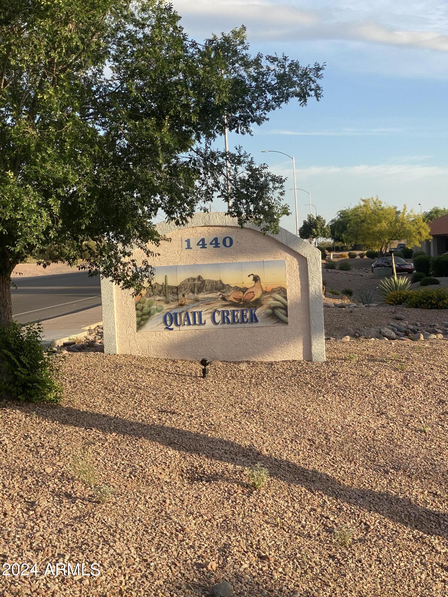 1440 North Idaho Road, Unit 1013 Apache Junction, AZ 85119 - Photo 39 of 40 a view of a street with a building in the background