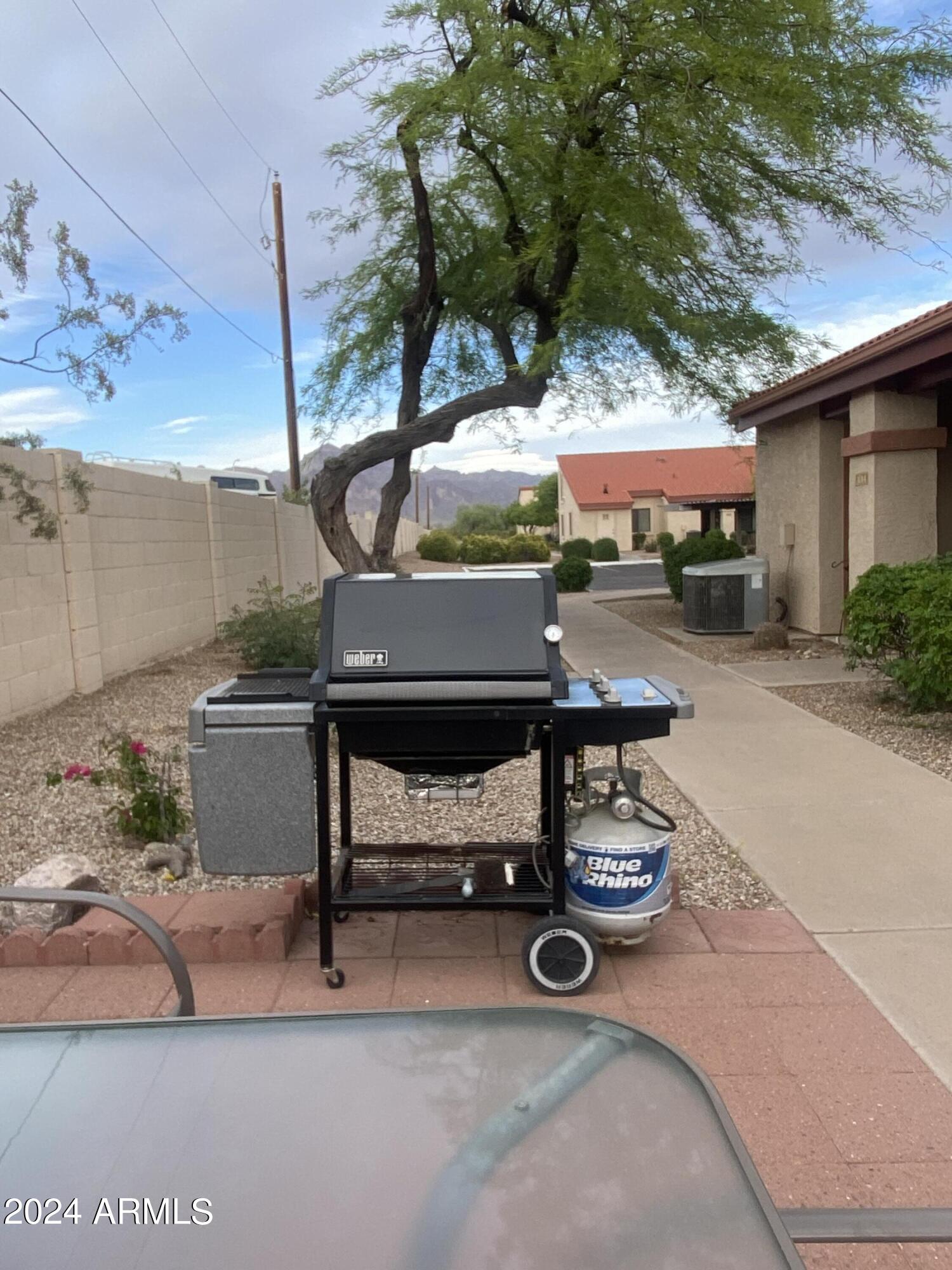 1440 North Idaho Road, Unit 1013 Apache Junction, AZ 85119 - Photo 6 of 40 a view of a patio with a table and chairs