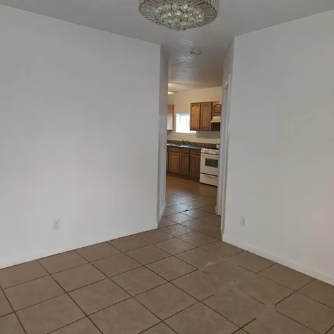 a view of a kitchen from the hallway
