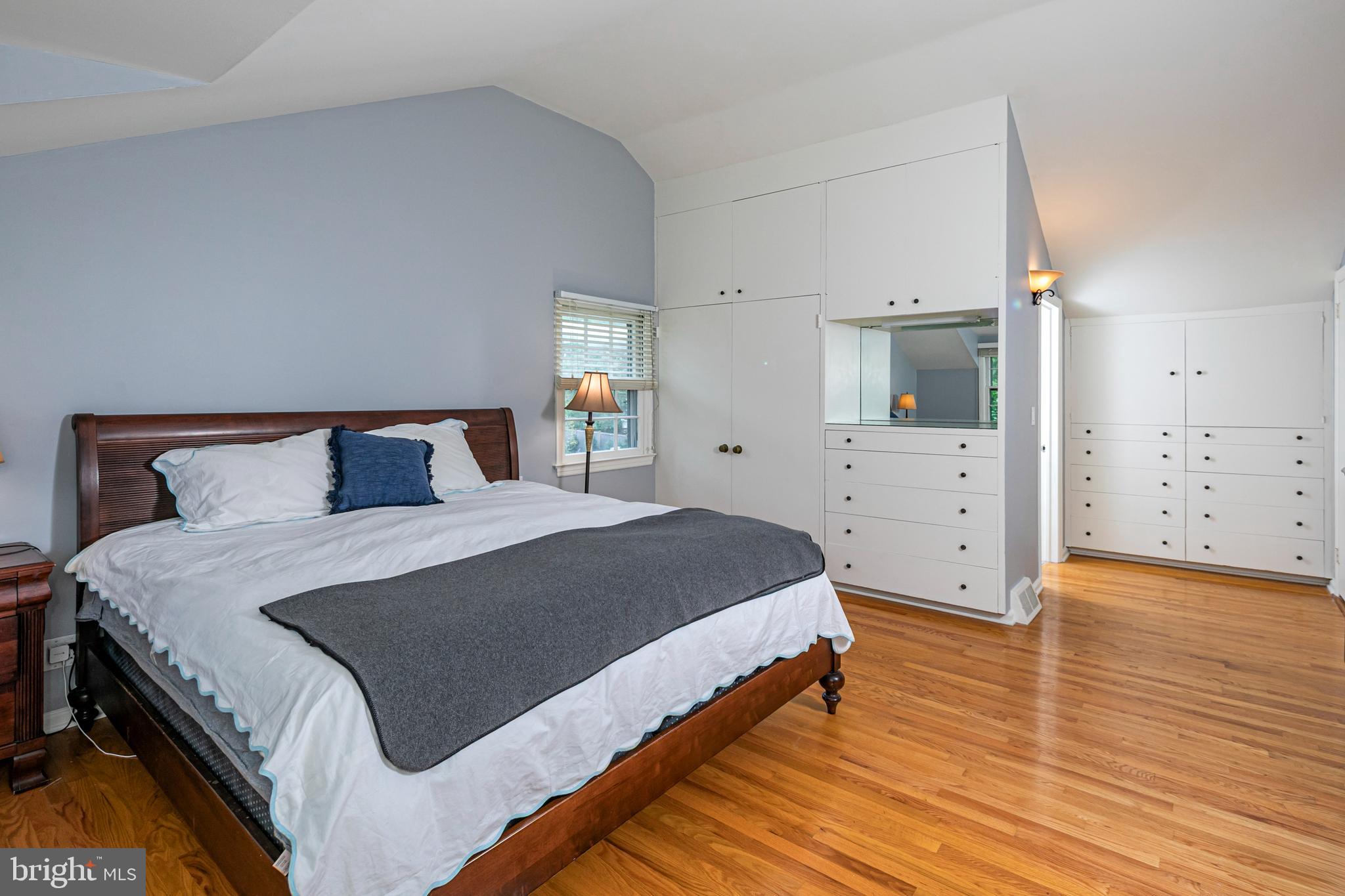 219 Russell Road Princeton, NJ 08540 - Photo 18 of 27 a bedroom with a bed and wooden floor