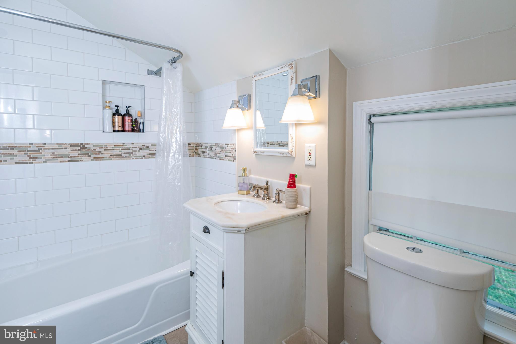 219 Russell Road Princeton, NJ 08540 - Photo 20 of 27 a bathroom with a sink a toilet and a bathtub