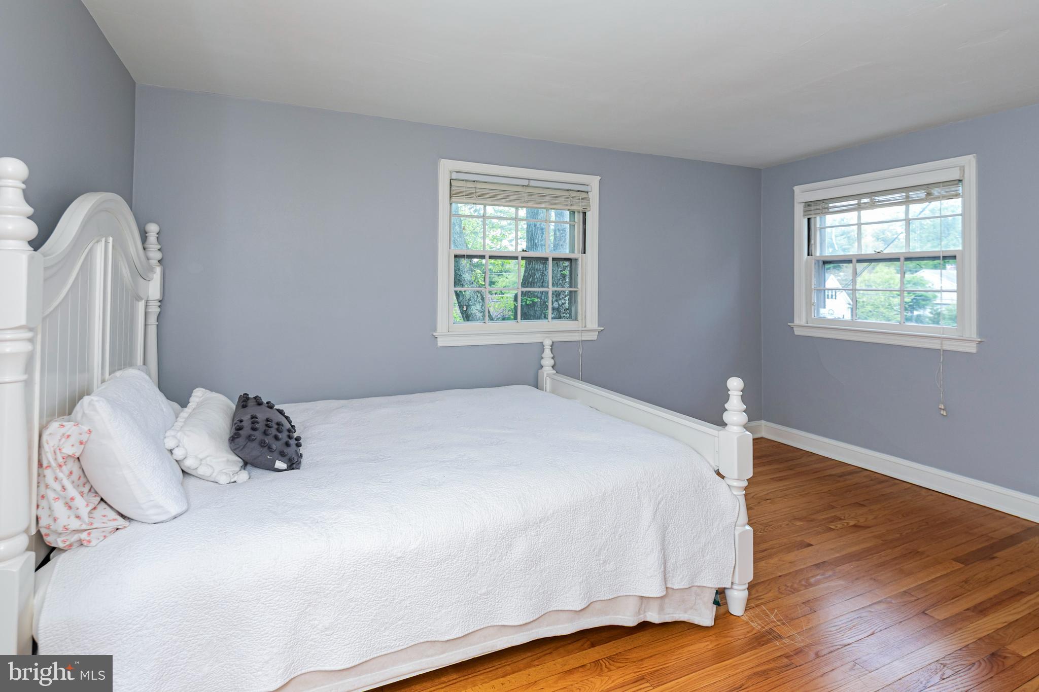 219 Russell Road Princeton, NJ 08540 - Photo 21 of 27 a bedroom with a bed and wooden floor