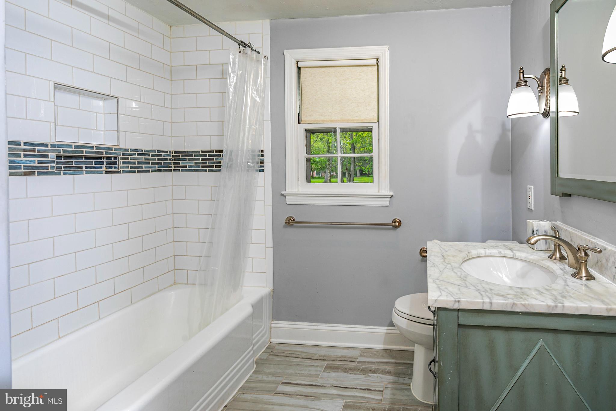 219 Russell Road Princeton, NJ 08540 - Photo 22 of 27 a bathroom with a sink and a bathtub
