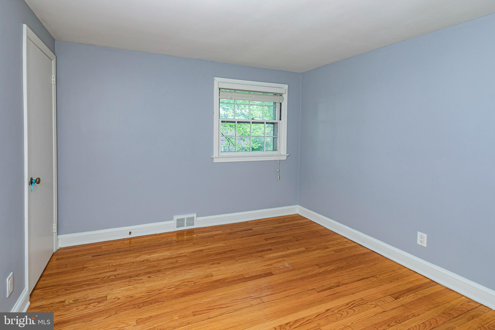 219 Russell Road Princeton, NJ 08540 - Photo 23 of 27 a view of an empty room with wooden floor and a window