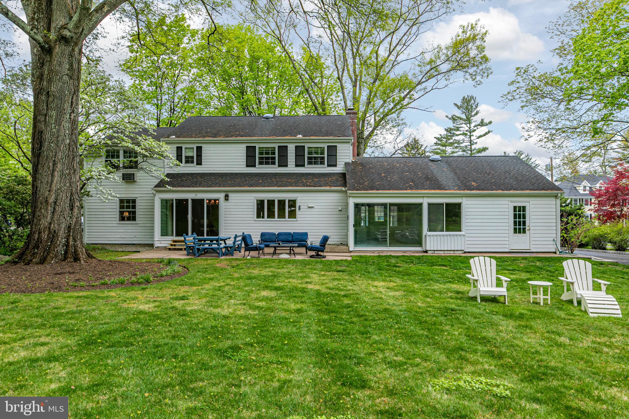 219 Russell Road Princeton, NJ 08540 - Photo 25 of 27 a front view of house with a garden and trees
