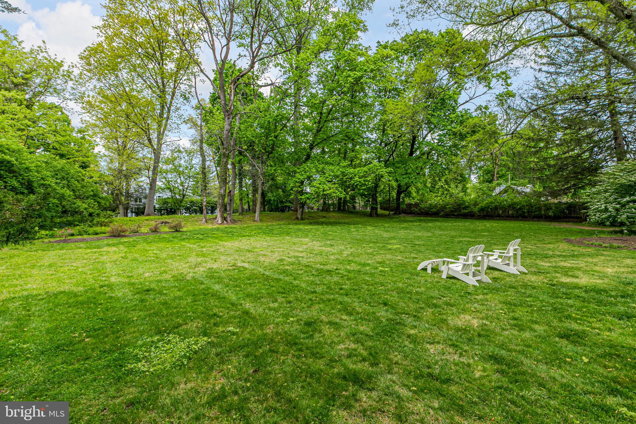 219 Russell Road Princeton, NJ 08540 - Photo 26 of 27 a view of a golf course with a lake