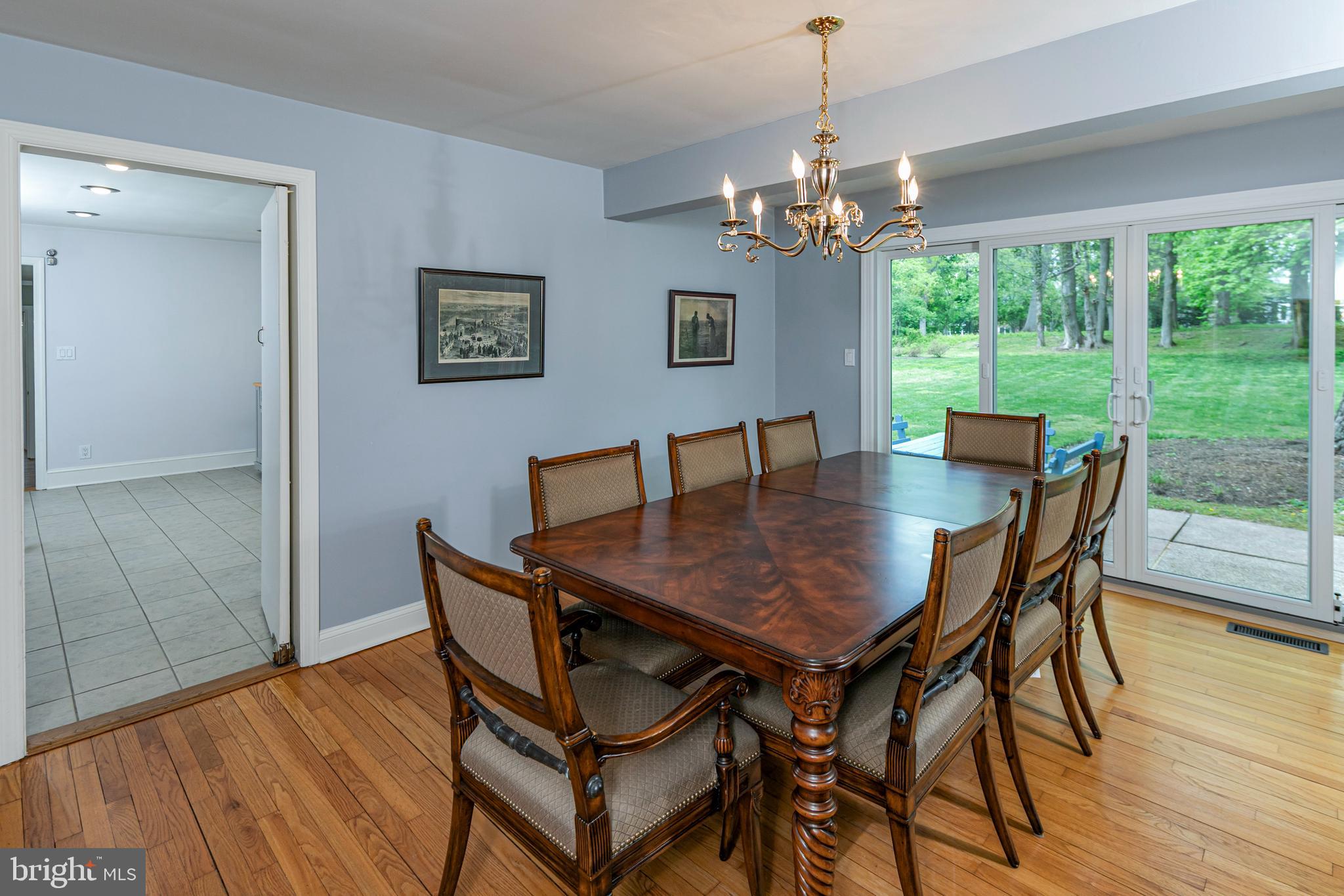 219 Russell Road Princeton, NJ 08540 - Photo 7 of 27 a dining room with furniture a large window and wooden floor