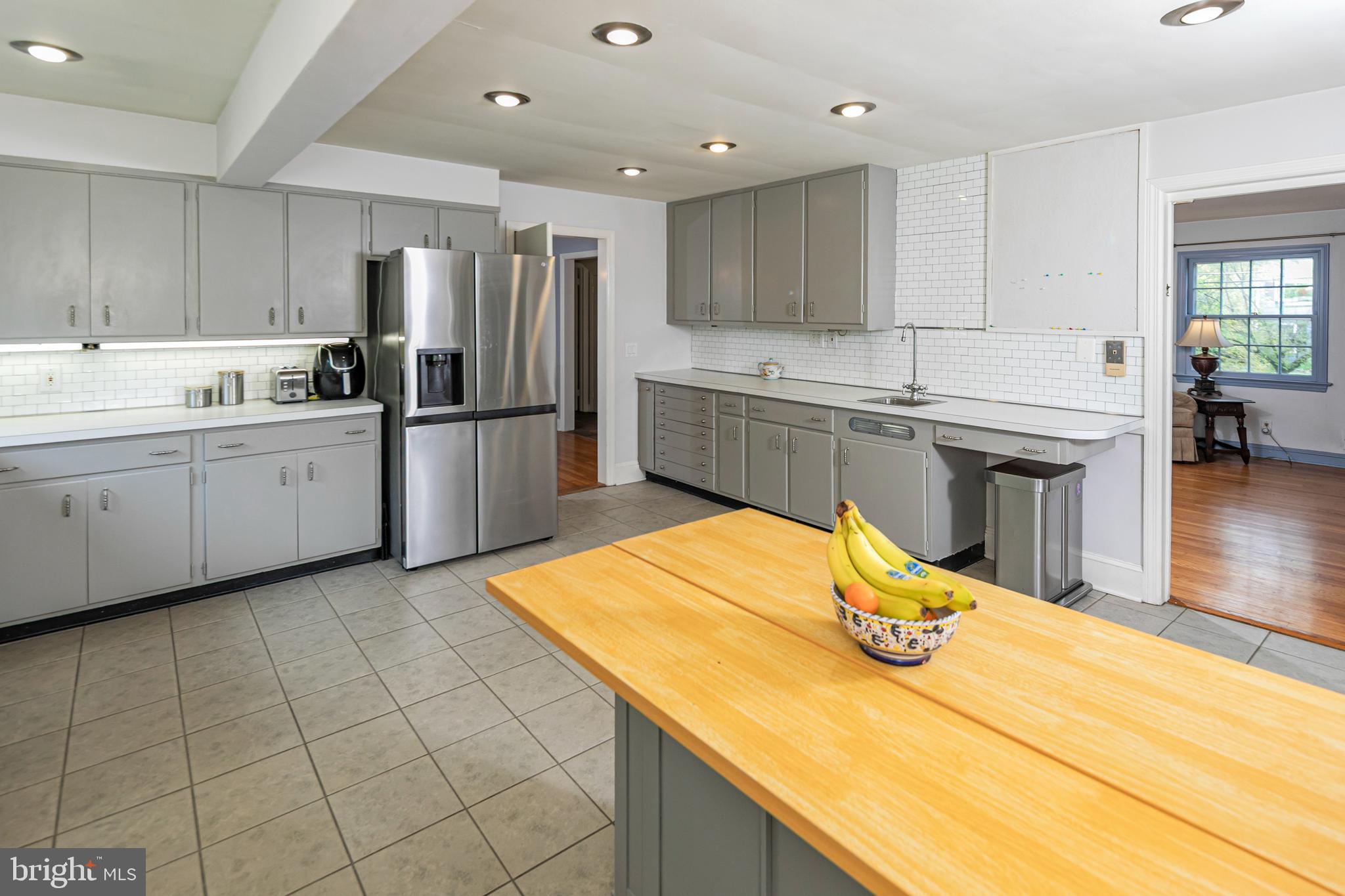 219 Russell Road Princeton, NJ 08540 - Photo 8 of 27 a kitchen with stainless steel appliances granite countertop a sink refrigerator and cabinets