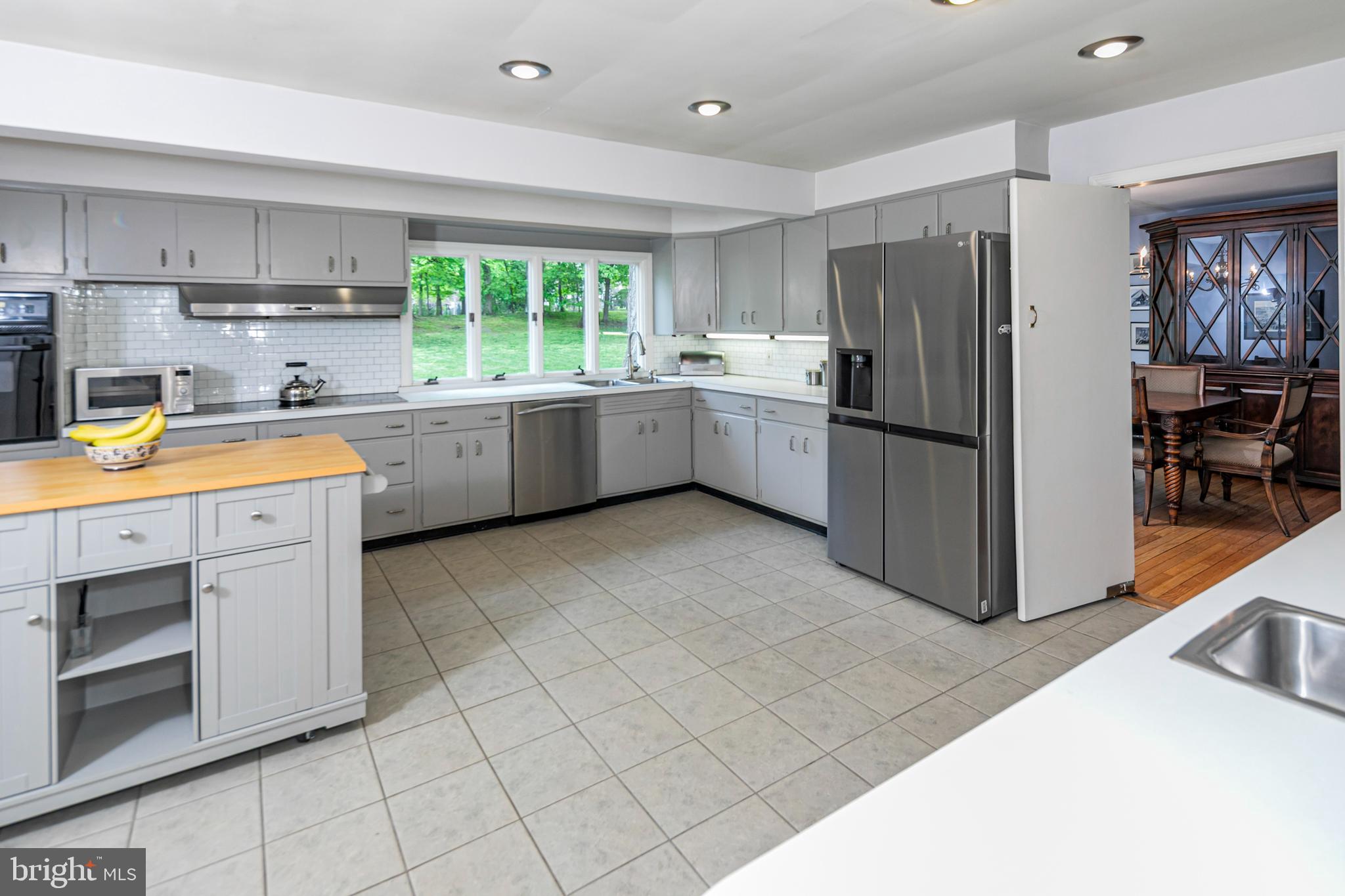 219 Russell Road Princeton, NJ 08540 - Photo 9 of 27 a kitchen with a sink cabinets and window