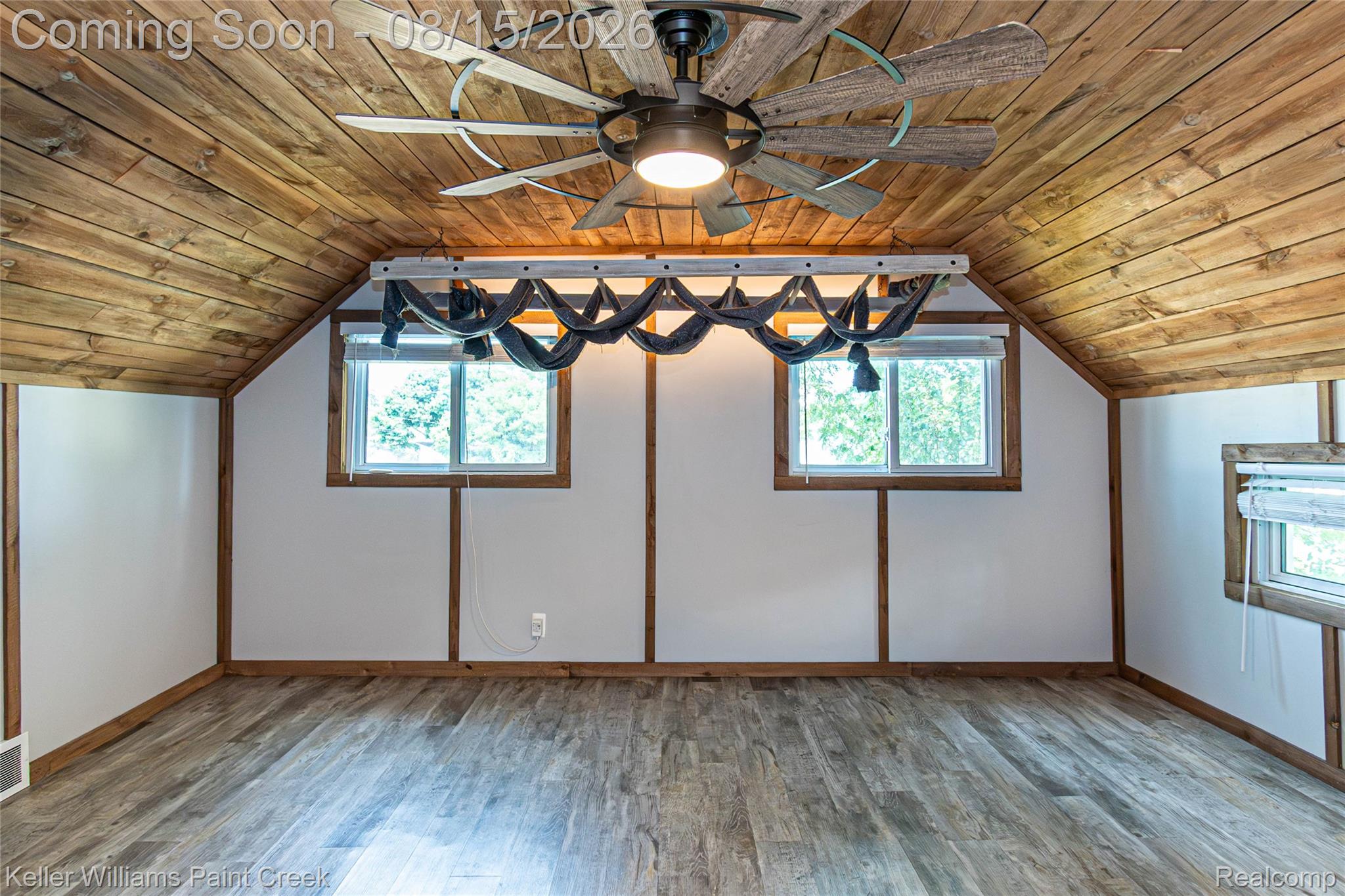 330 East Washington Street Romeo, MI 48065 - Photo 53 of 68 Wood-finish flooring, exposed wood beam ceiling, wood-frame windows, and a ceiling fan with integrated lighting