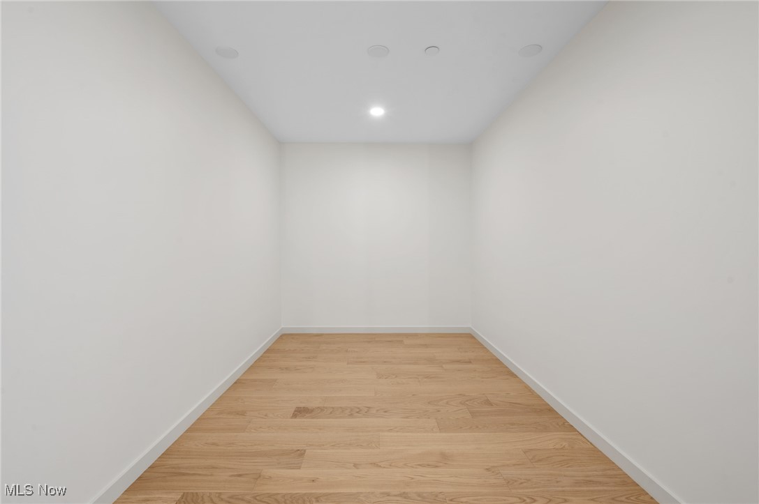 22700 Lake Road, Unit 306 Rocky River, OH 44116 - Photo 18 of 28 Empty room with light wood-style floors and recessed lighting