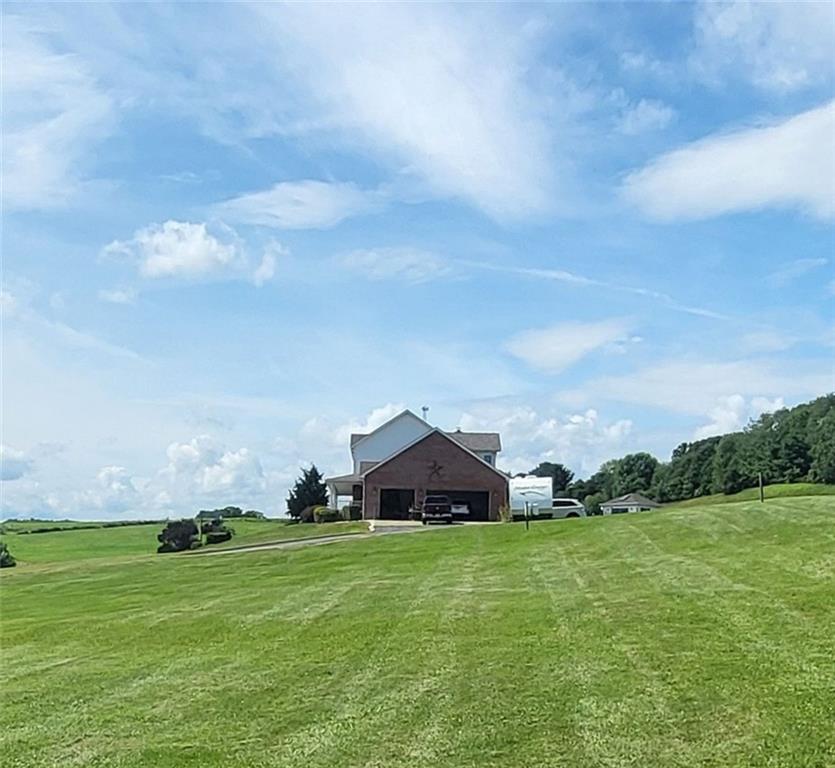 56 Lanik Road Bentleyville, PA 15314 - Photo 5 of 50 a front view of a house with a garden