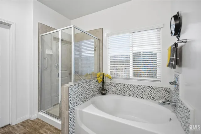 a bathroom with bathtub and window