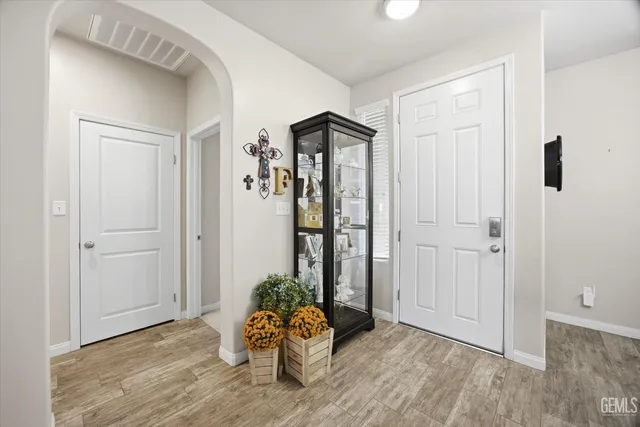 a view of an entryway with wooden floor