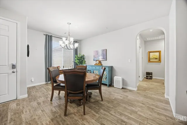 a view of a dining room with furniture and window