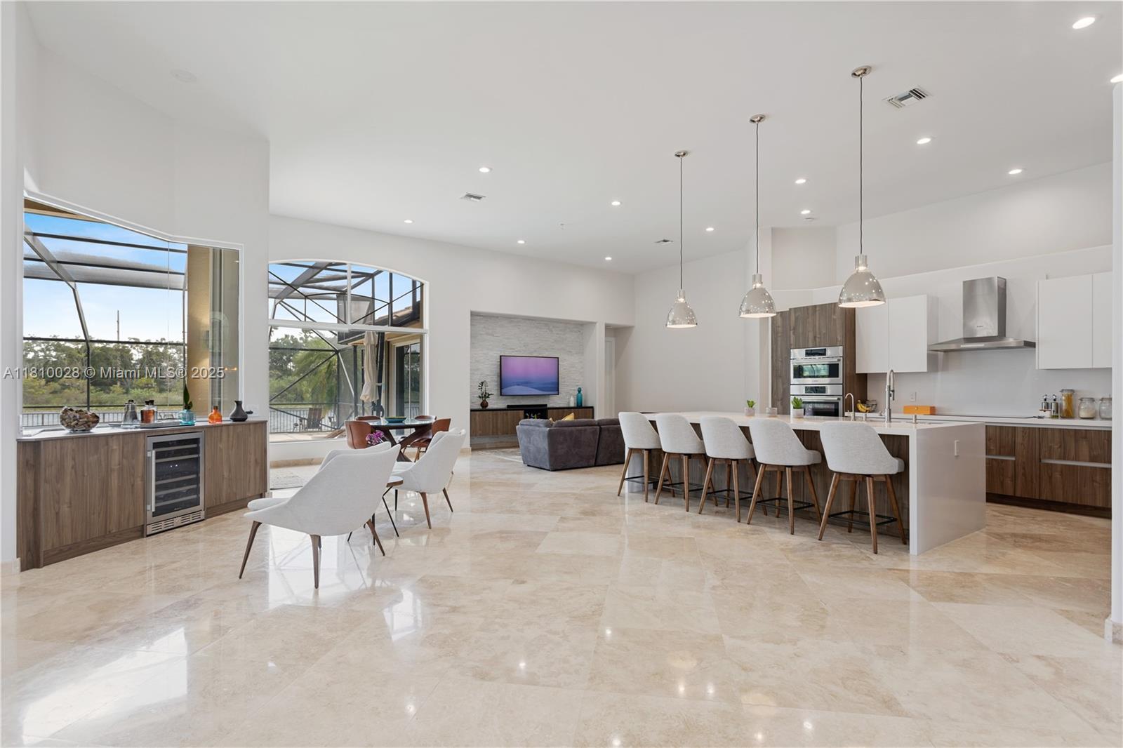 146 Dockside Circle Weston, FL 33327 - Photo 1 of 34 a living room with furniture kitchen area and a large window