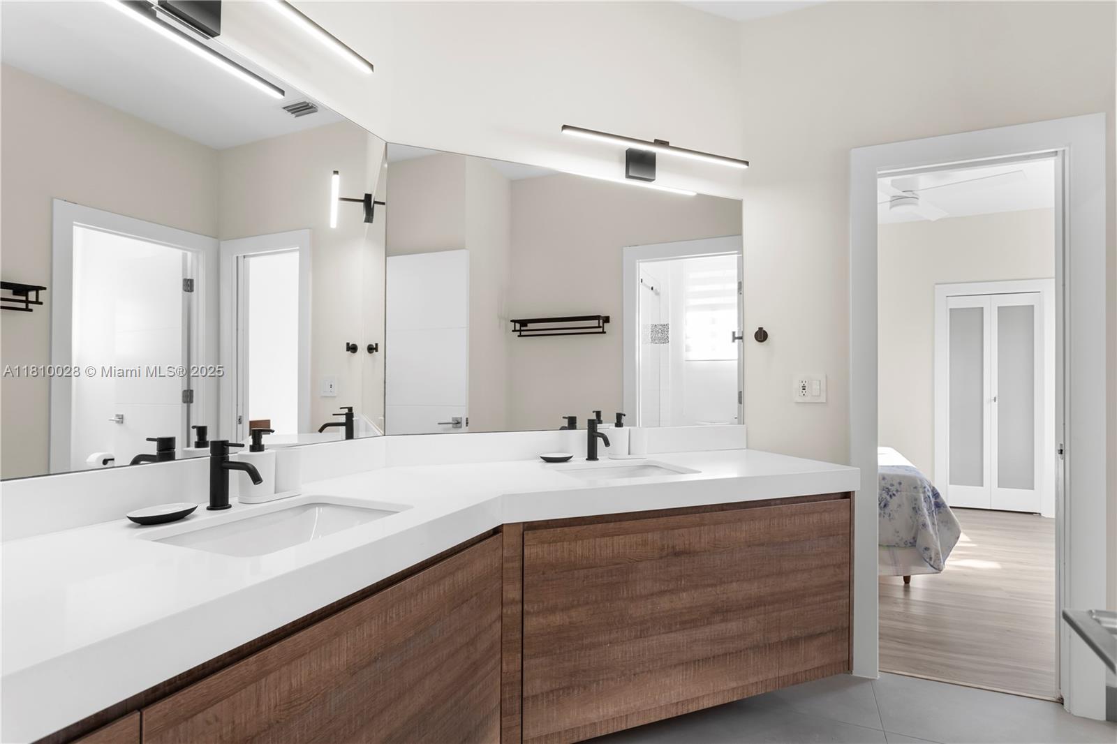 146 Dockside Circle Weston, FL 33327 - Photo 13 of 34 a bathroom with a sink double vanity and a mirror