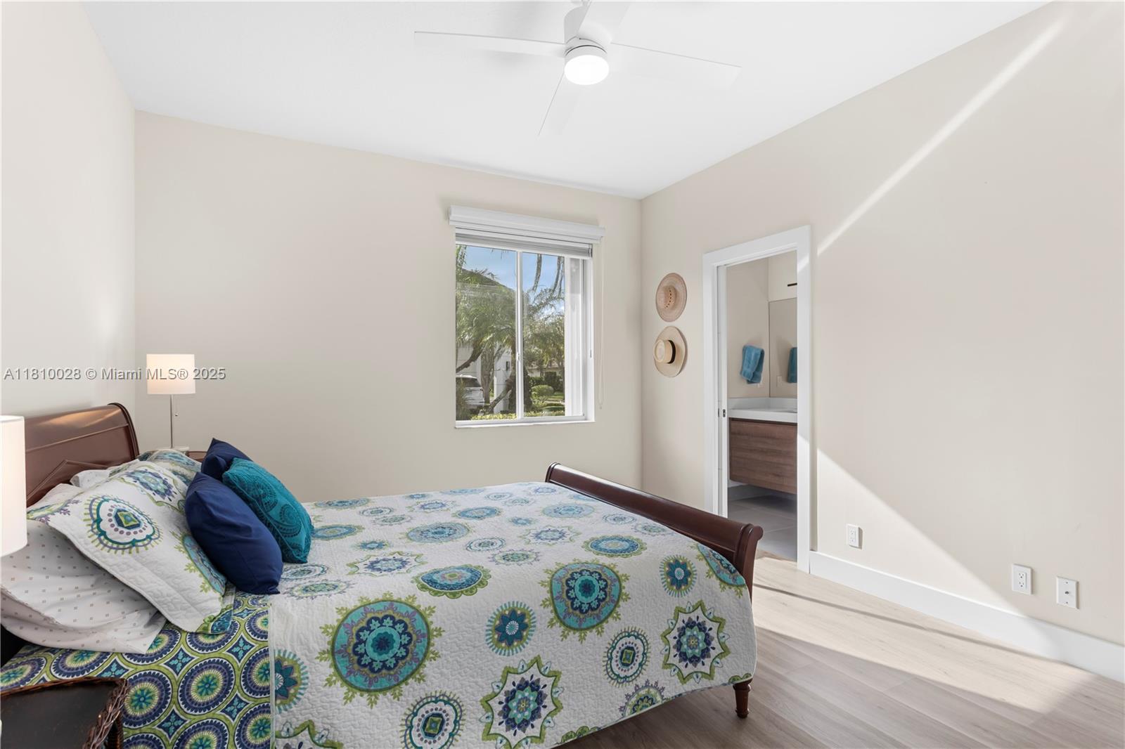 146 Dockside Circle Weston, FL 33327 - Photo 17 of 34 a bedroom with a large bed and a window