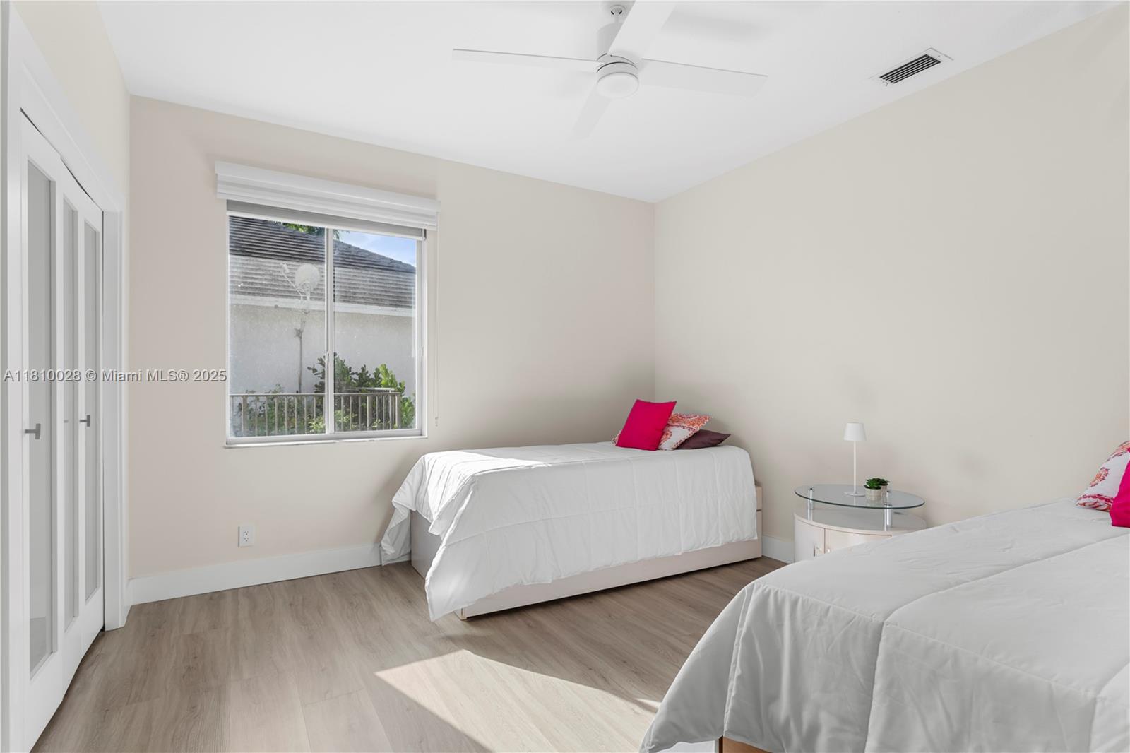 146 Dockside Circle Weston, FL 33327 - Photo 20 of 34 a bedroom with two beds and a window