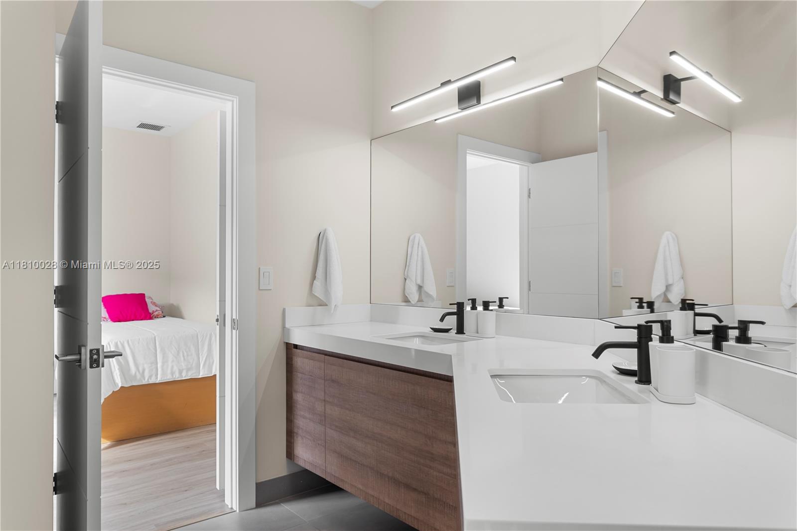 146 Dockside Circle Weston, FL 33327 - Photo 22 of 34 a bathroom with a sink and a mirror