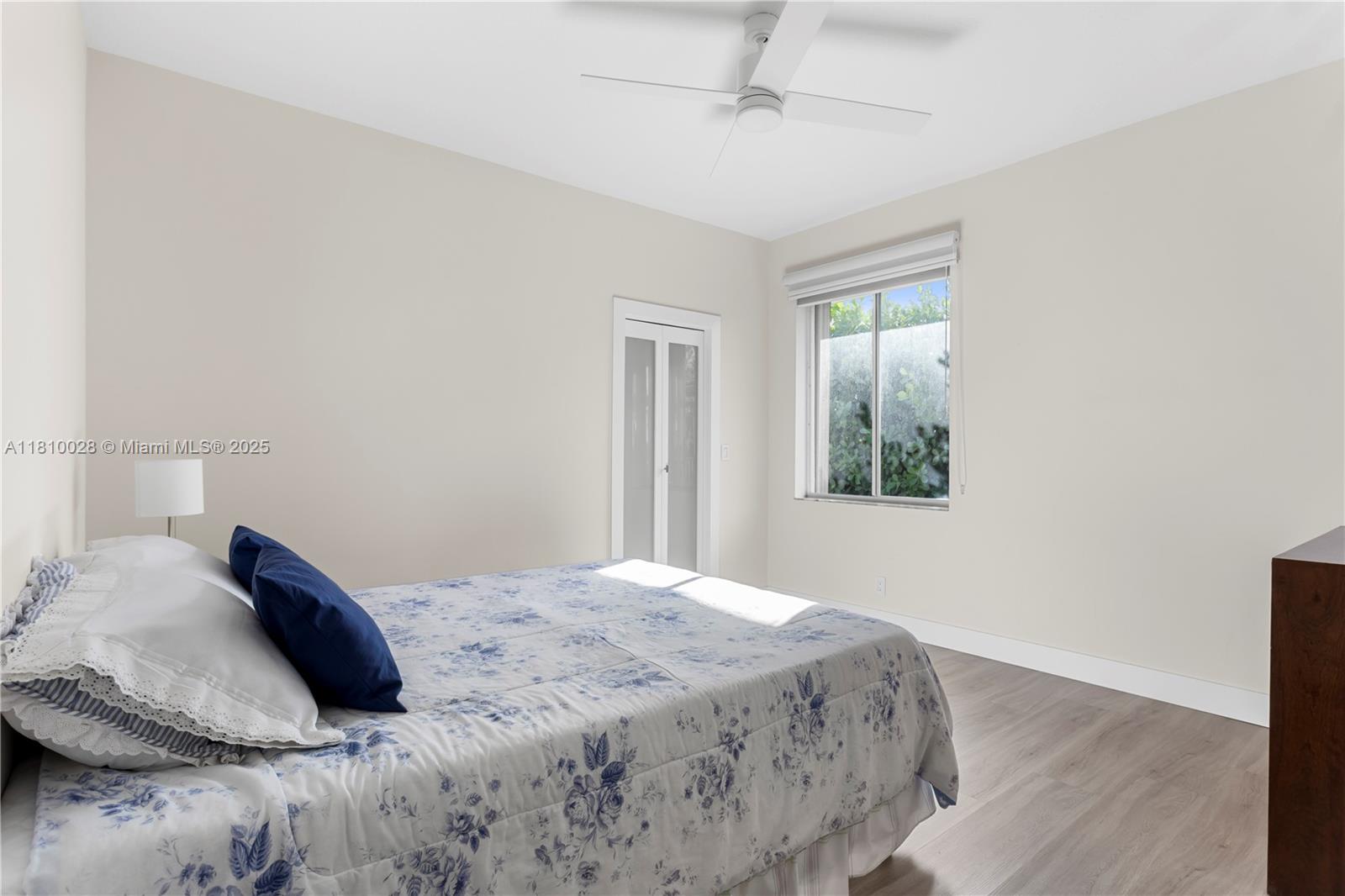 146 Dockside Circle Weston, FL 33327 - Photo 23 of 34 a bedroom with a bed and a window