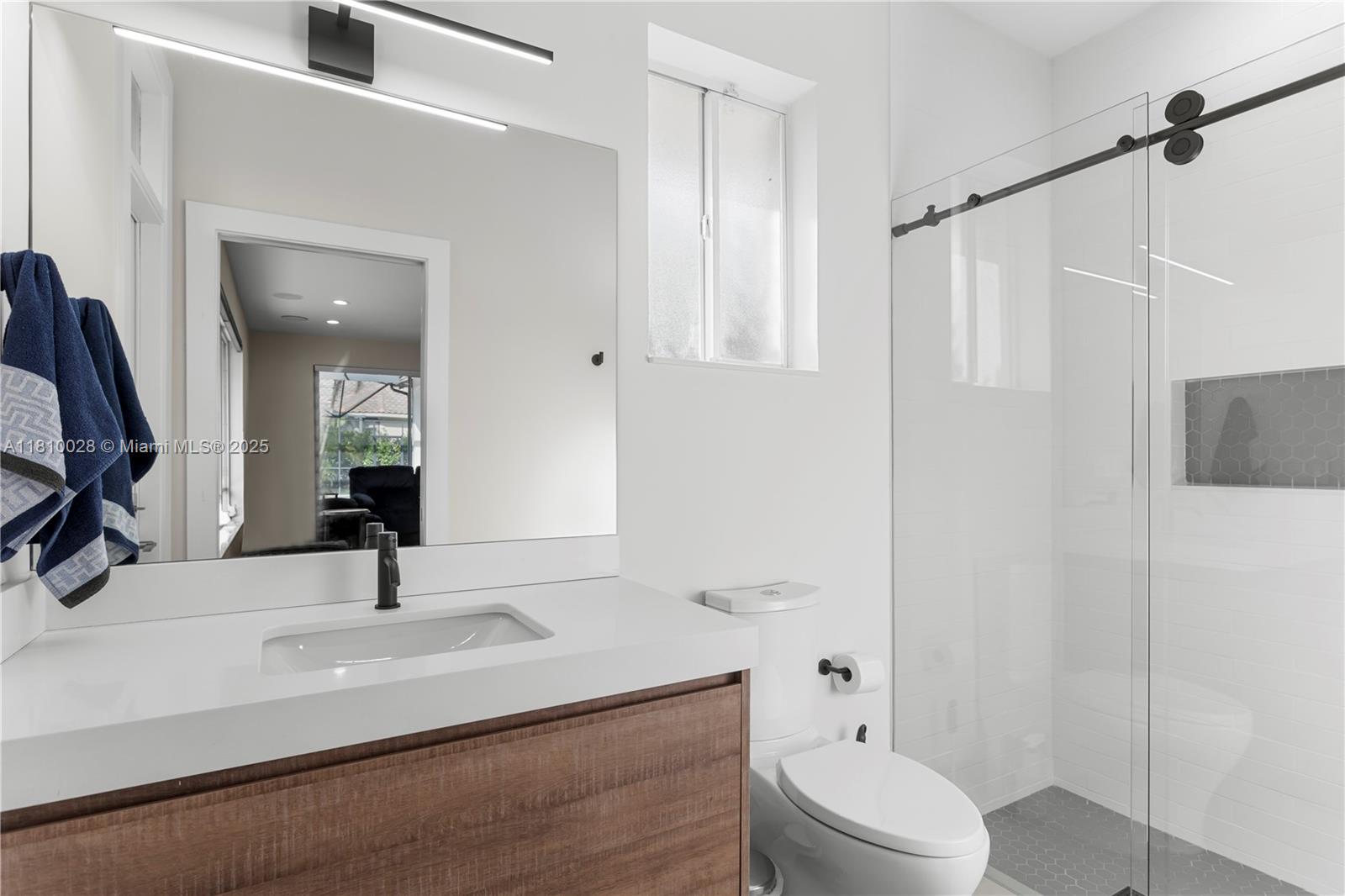 146 Dockside Circle Weston, FL 33327 - Photo 24 of 34 a bathroom with a sink a toilet and shower