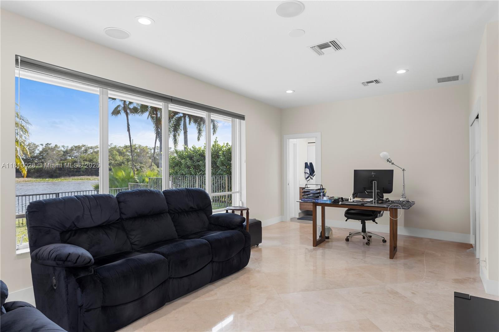 146 Dockside Circle Weston, FL 33327 - Photo 26 of 34 a living room with furniture and a large window