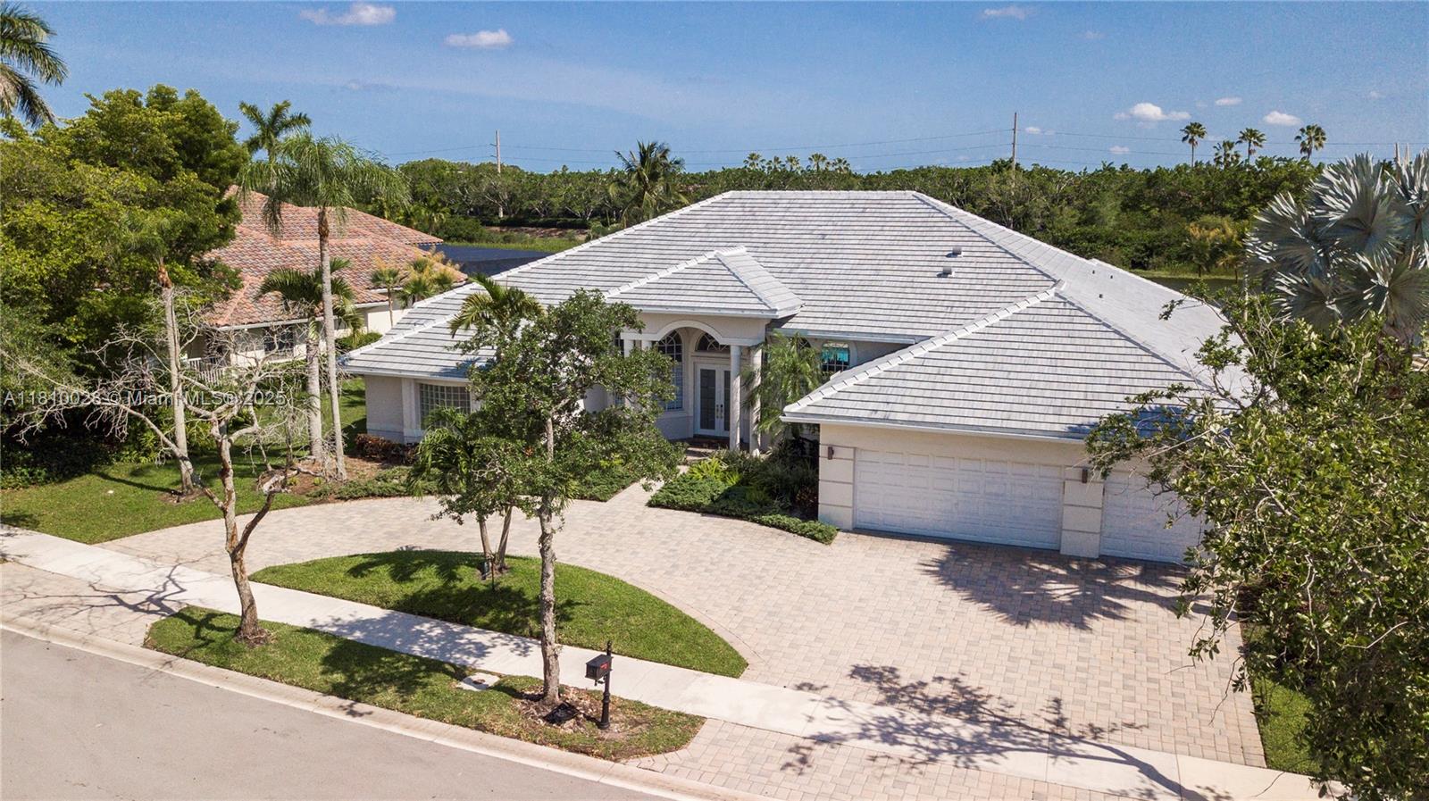 146 Dockside Circle Weston, FL 33327 - Photo 29 of 34 a front view of a house with garden