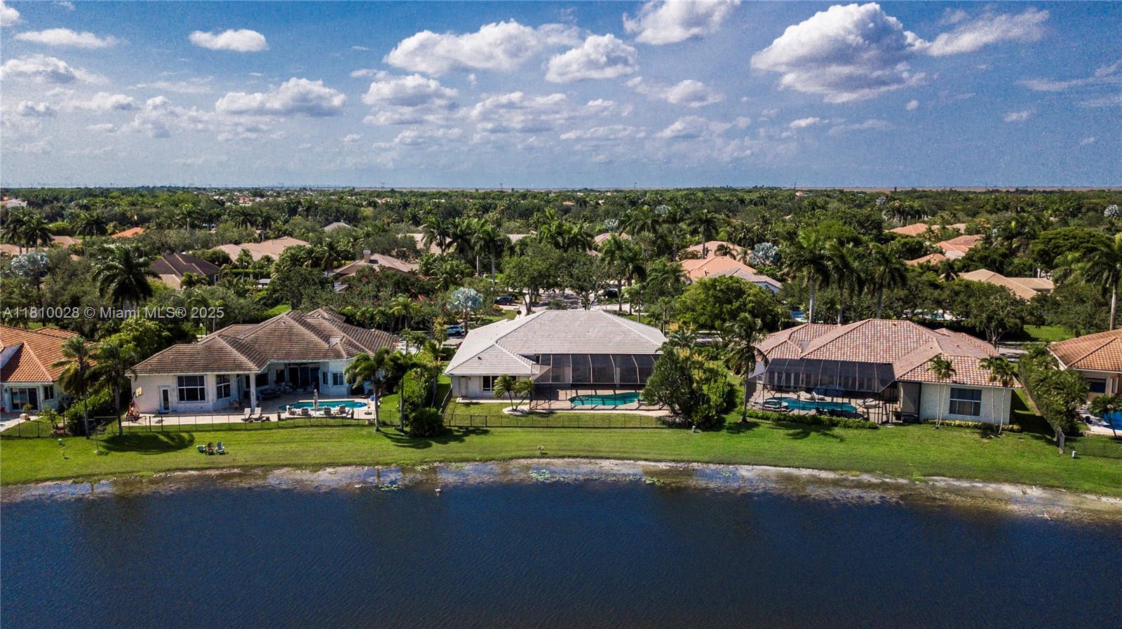 146 Dockside Circle Weston, FL 33327 - Photo 31 of 34 a view of outdoor space with garden and trees