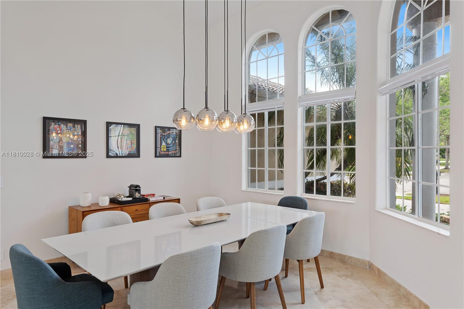 146 Dockside Circle Weston, FL 33327 - Photo 4 of 34 a view of a dining room with furniture and chandelier