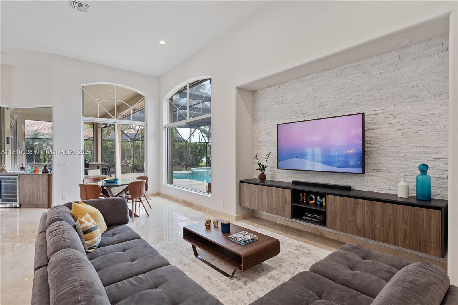 146 Dockside Circle Weston, FL 33327 - Photo 6 of 34 a living room with furniture and a flat screen tv