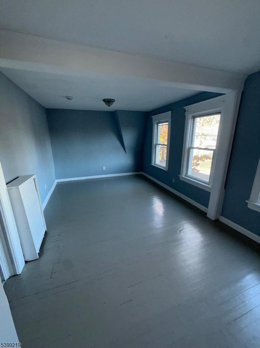 704 Park Avenue Elizabeth, NJ 07208 - Photo 11 of 15 an empty room with windows