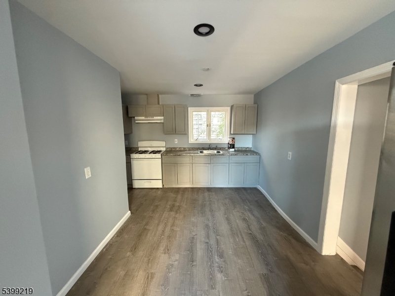 704 Park Avenue Elizabeth, NJ 07208 - Photo 6 of 15 a view of a kitchen with wooden floor