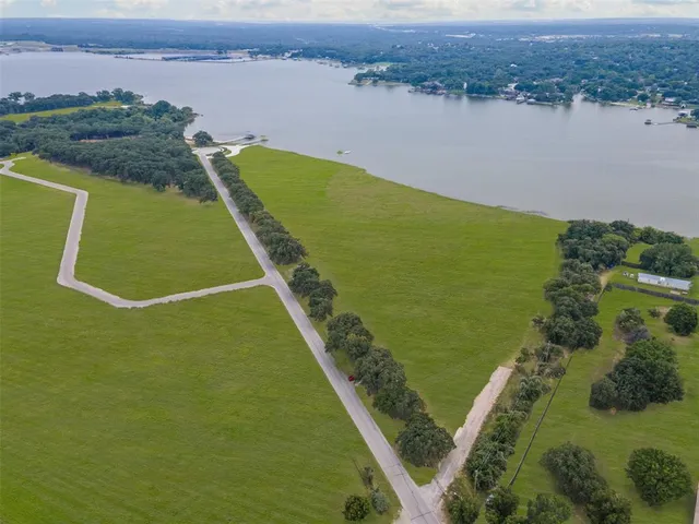 a view of a lake with a yard