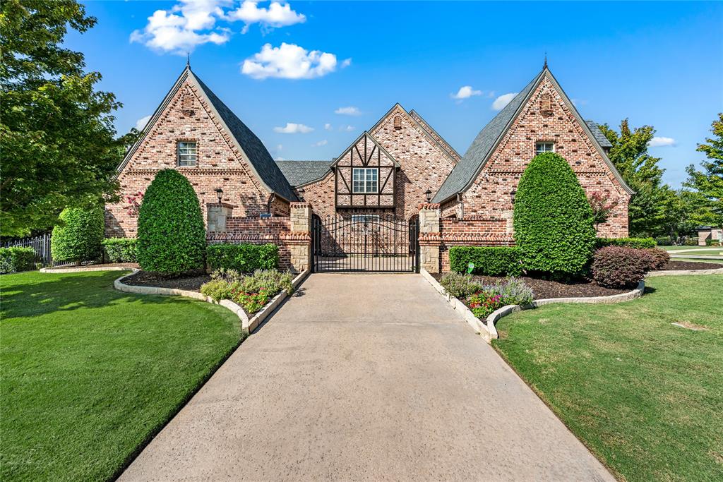 6900 Rockingham Court Colleyville, TX 76034 - Photo 36 of 40 Brick and Tudor-style residence featuring a prominent gabled roofline with private, gated motor court with basketball court.