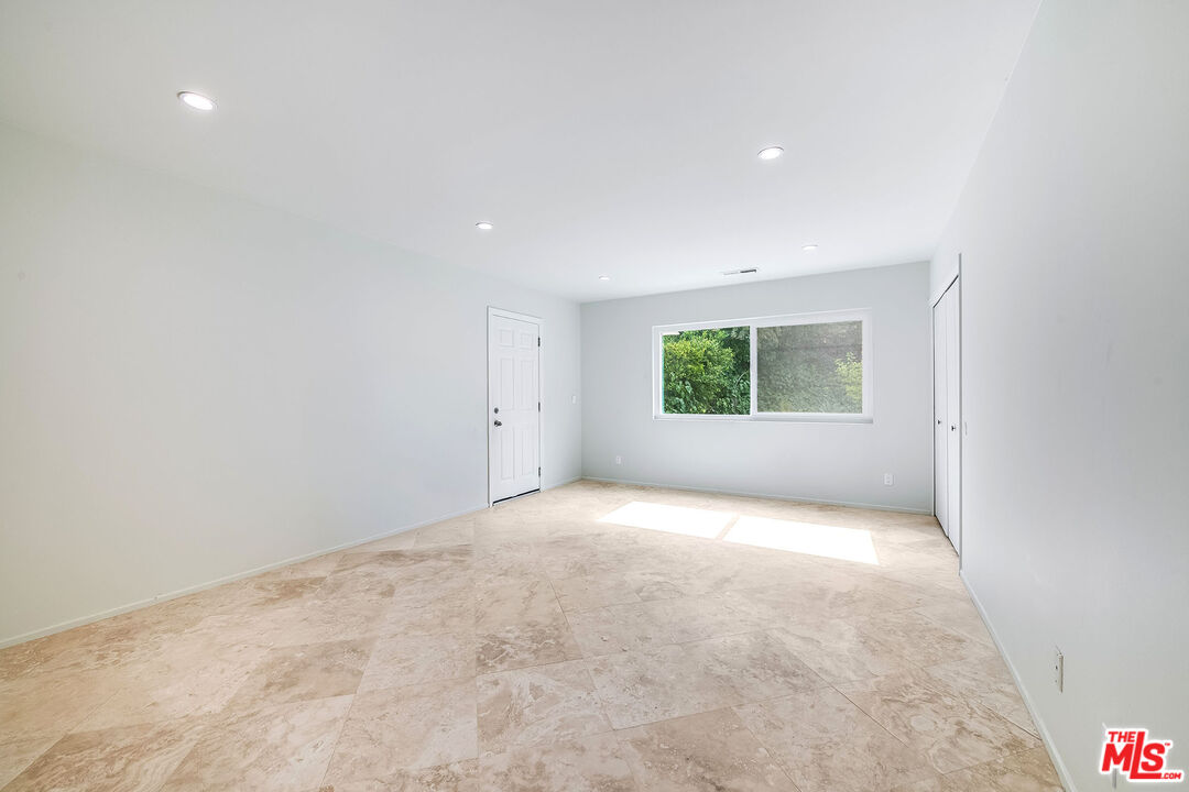 3643 Ballina Canyon Road Encino, CA 91436 - Photo 17 of 47 an empty room with windows